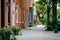 Brick rowhouses and sidewalk on Bond Street in Fells Point, Baltimore, Maryland