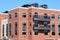 Brick and stone apartment building with outdoor patios