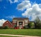 Brick Suburban Home On A Hillside