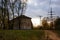 Brick two-storey house, on the background of the autumn countryside landscape. Belarus. Zhodino