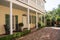 Brick Veranda on Yellow and Green Home