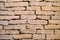 Brick vintage wall plastered with a stone close up / Part of architectural background, rustic materials and texture detail