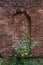 Brick wall with arched blind window