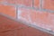 Brick wall close-up plano gray lines angle part background building