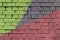 Brick wall with colorful geometric graffiti. Abstract aerosol pattern for background.