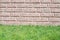 Brick wall with grass floor