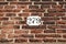 Brick wall with house number