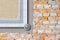 Brick wall insulated with polystyrene panels pasted on the wall surface - Improvement of buildings energy performance - concept