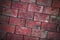 Brick wall made of red blocks with a slope of masonry. texture background