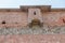 Brick wall of an old castle with toilet rooms