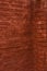 Brick wall painted in terracotta color.