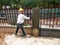 Brick wall plastered by construction workers using the cement plaster.