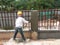 Brick wall plastered by construction workers using the cement plaster.