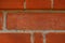 Brick wall from red bricks close-up. Horizontal texture