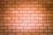 Brick wall with red bricks Red, orange brick background, arranged in complex horizontal rows in layers interlocked with cement.
