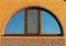 Brick wall with semicircle window, closeup
