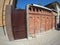 Brick wall with a solid metal door in a city street