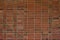 Brick wall texture background with red and brown bricks in a stack bond pattern