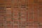Brick wall texture background with red and brown bricks in a stack bond pattern