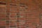 Brick wall texture background with red and brown bricks in a stack bond pattern