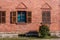 Brick wall with window and wodden shutters