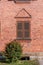 Brick wall with window and wodden shutters