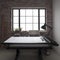 Brick-walled workspace with large window and desk setup.