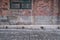 Brick walls and black window of old Cattle Depot Artist Village in Hong Kong