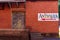 Brick and Wooden Building with an Antiques Sign