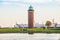 Bricked lighthouse with green roof on the coast of Cuxhaven, Germany