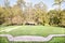 Bricked path through a formal manicured garden