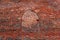 Bricked window in red brick wall