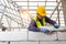 Bricklayer builder working with autoclaved aerated concrete blocks. Walling, installing bricks on construction site, Engineering