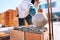 Bricklayer industrial male worker installing brick masonry on exterior wall with trowel putty knife