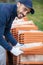 bricklayer industrial worker installing brick masonry