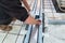 Bricklayer is installing a drain gully on a terrace