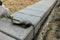 Bricklayer lays a wall of concrete blocks