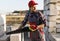 Bricklayer man is sawing autoclaved concrete blocks