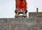 Bricklayer putting down another row of bricks in site during the construction the viaduct.