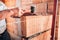 Bricklayer worker installing interior walls with rubber hammer, level and putty knife