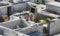 Bricklayer worker in safety orange vest and hard hat make walls of white silicate bricks on a construction site of a big