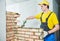 Bricklaying. Construction worker building a brick wall