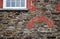 Brickwork arch and window surround or mullion, in red brick, in