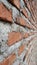 Brickwork of unfinished wall. Weathered and aged. Perspective view. Use for background or wallpaper.