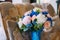 Bridal bouquet with creamy roses and peonies and blue hydrangeas. Wedding morning. Close-up