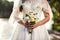 bridal bouquet in hands of the bride, bridal accessories, wedding European, American Wedding