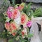 Bridal bouquet lying on the stones. Wedding bouquet of peach roses by David Austin, single-head pink rose aqua, eucalyptus, ruscus