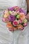 Bridal bouquet  multicoloured roses  mixed roses in flower arrangement