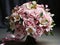 Bridal bouquet of roses for the wedding. Groom boutonniere. Wedding accessories from natural flowers. Wedding day. AI Generative
