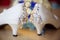 Bridal bouquet, wedding rings on a pillow with shells, bride`s shoes, garter. Wedding details in a marine style. The morning of